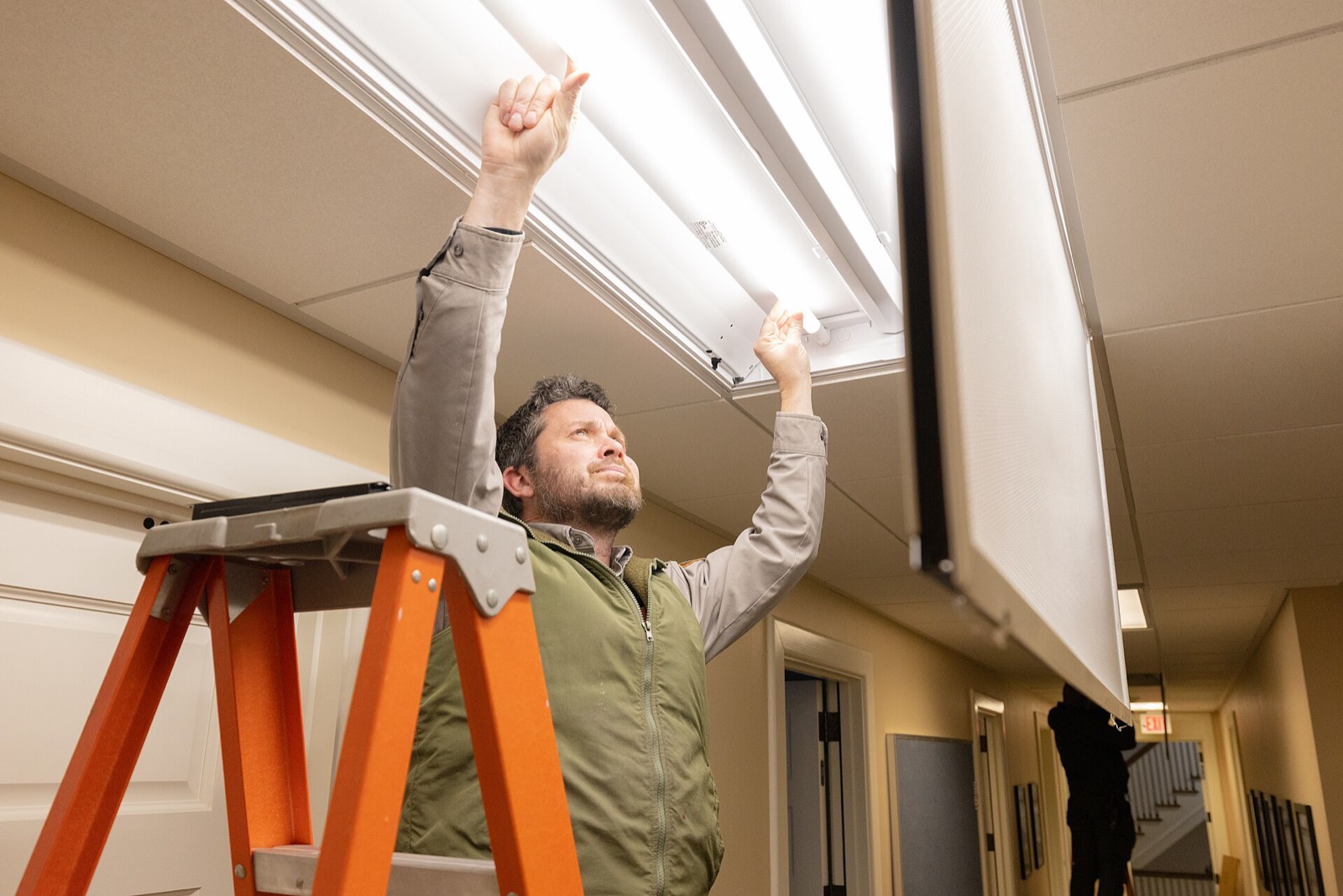 Stacks Electric electrician installing LED lighting